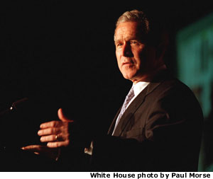 Photo of President Bush speaking at a lecturn. White House photo by Paul Morse