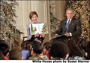 Laura Bush and President George W. Bush read to visiting children during the White House Children's Story Hour Dec. 10. White House photo by Susan Sterner.