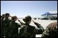 Military personnel from Nellis Air Force Base salute President George W. Bush as he boards Air Force One before departing Las Vegas, Nev., Tuesday, Sept. 14, 2004. White House photo by Eric Draper.