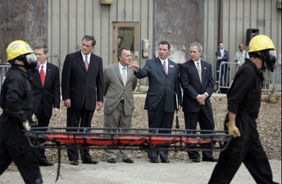 President George W. Bush observes a demonstration by first responders at Northeastern Illinois Public Training Academy in Glenview, Illinois on Thursday July 22, 2004.