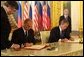 President George W. Bush and Russian President Vladimir Putin sign an arms reduction treaty at the Kremlin in Moscow, Russia on May 24, 2002. White House photo by Paul Morse.