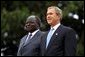 Presidents Bush and Kibaki watch the military review portion of the State Arrival Ceremonies on the South Lawn of the White House Monday, October 5, 2003. White House photo by Susan Sterner.