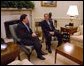 President George W. Bush meets with NATO Secretary General Lord Robertson in the Oval Office Wednesday, Feb 19, 2003. White House photo by Eric Draper.