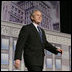 President George W. Bush walks on stage at the Renaissance Cleveland Hotel in Cleveland, Ohio, to deliver his remarks on the global war on terror, Monday, March 20, 2006, to members of the City Club of Cleveland.  White House photo by Paul Morse