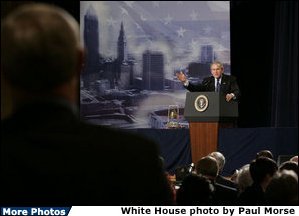President George W. Bush answers a question from an audience member at the Renaissance Cleveland Hotel in Cleveland, Ohio, following his remarks on the global war on terror, Monday, March 20, 2006, to members of the City Club of Cleveland.  White House photo by Paul Morse