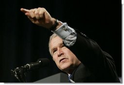 President George W. Bush calls on an audience member to ask a question at the Renaissance Cleveland Hotel in Cleveland, Ohio, following his remarks on the global war on terror, Monday, March 20, 2006, to members of the City Club of Cleveland.  White House photo by Paul Morse