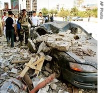 Iraqi security forces inspect scene after a blast in Tahrir Square killing three and wounding 11 in Baghdad