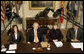 President George W. Bush, joined by Mrs. Laura Bush, talks with reporters during a briefing on volunteerism in the Roosevelt Room at the White House, Tuesday, Feb. 13, 2007, seen with Jean Case, chair of the Presidents Council on Service and Civic Participation, and Bob Goodwin, president and CEO of Points of the Light Foundation and Volunteer Center National Network.  White House photo by Eric Draper