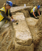 Archaeologists on site discovering the Roman sarcophagus