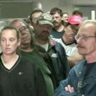 A long line of people waiting to file for unemployment benefits