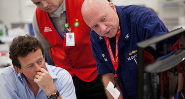 BP Group Chief Executive Tony Hayward discusses the operation with a US Coast Guard 
                                                