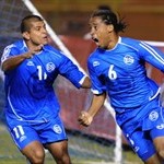 El Salvador's Shawn Martin (R) celebrates a goal with teammate Ronald Cerritos (L) during an elimina