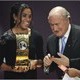 Brazil's Marta stands beside of FIFA president Joseph S. Blatter after she was awarded FIFA Women's World Player of the Year