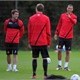 Rio Ferdinand and Michael Owen share a joke during a Manchester United training session