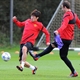 Manchester United's Dimitar Berbatov vies with Park Ji-Sung during a training session
