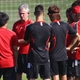 Jupp Heynckes (2nd L), head coach of Bayern Muenchen talks to his players prior the training session 