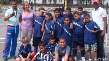 Miriam Schöps with her team of young footballers